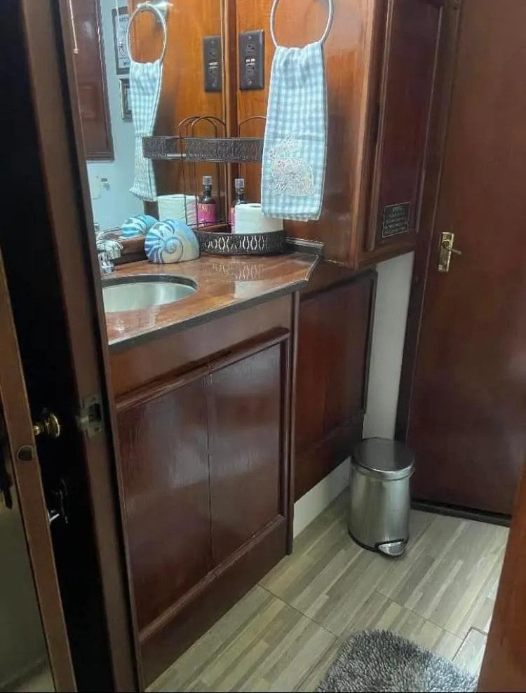 Slide: The Image of 1986 Post 43 Sport Fisher bathroom with wooden cabinetry and modern amenities. - 45