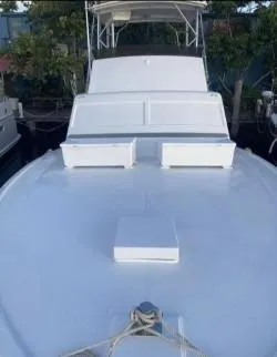 Slide: The Image of 1986 Post 43 Sport Fisher boat with sleek white deck and cabin. - 5