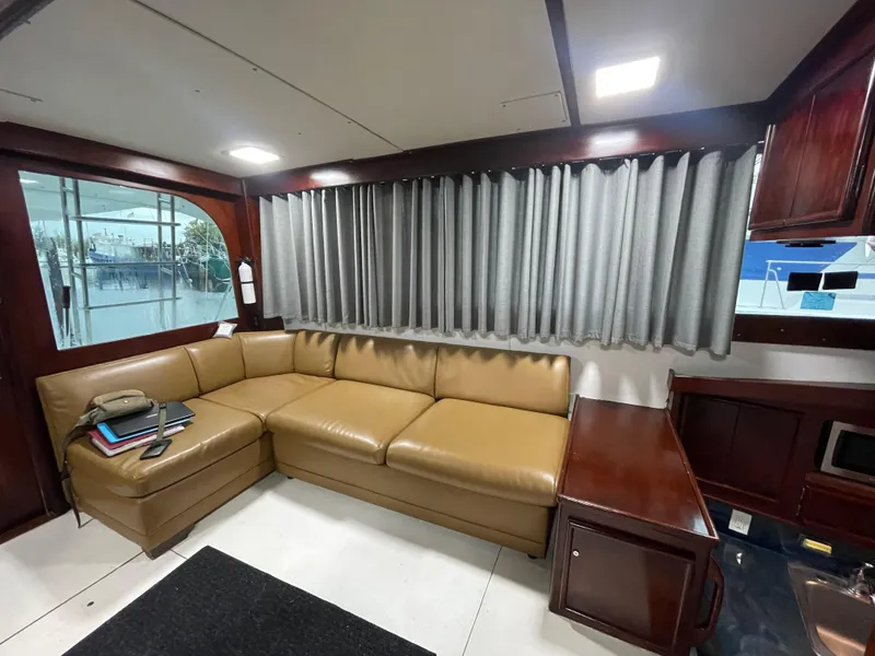 Slide: The Image of Luxurious interior of 1986 Post 43 Sport Fisher with leather seating and wood accents. - 7