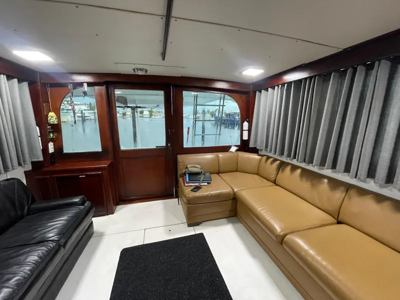 Slide: The Image of Interior of 1986 Post 43 Sport Fisher yacht with leather seating and wood accents. - 8