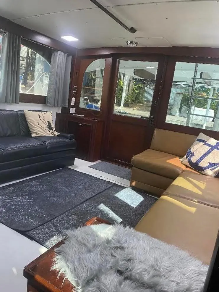 Slide: The Image of Interior of 1986 Post 43 Sport Fisher yacht with cozy seating and stylish decor. - 9