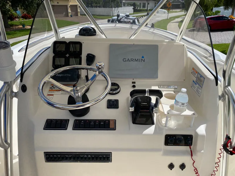 Slide: The Image of 2007 Pursuit 310 Center Console boat dashboard with Garmin navigation system. - 18