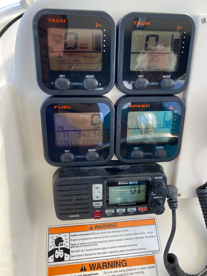 Slide: The Image of 2007 Pursuit 310 Center Console dashboard with tachometer, fuel, and speed gauges. - 20