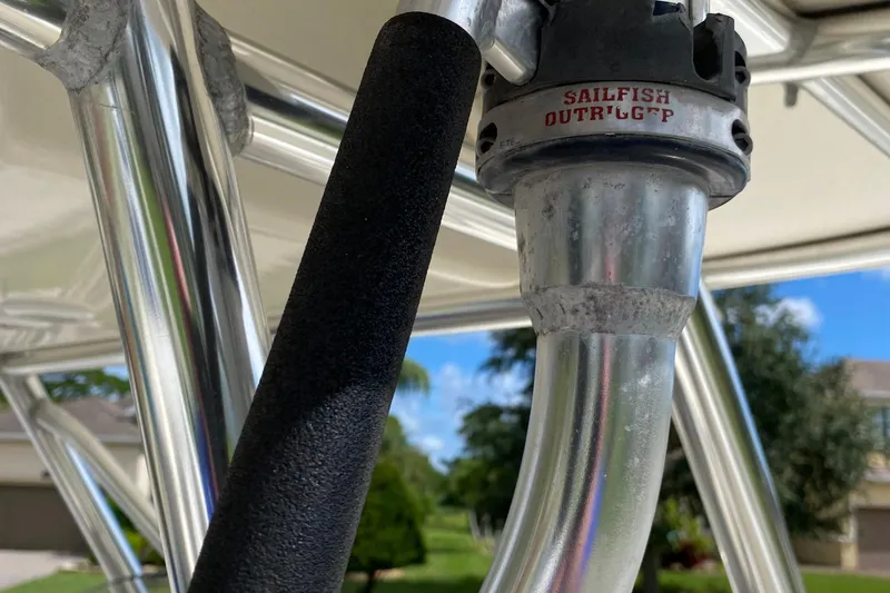 Slide: The Image of Close-up of a 2007 Pursuit 310 Center Console boat's Sailfish outrigger. - 25