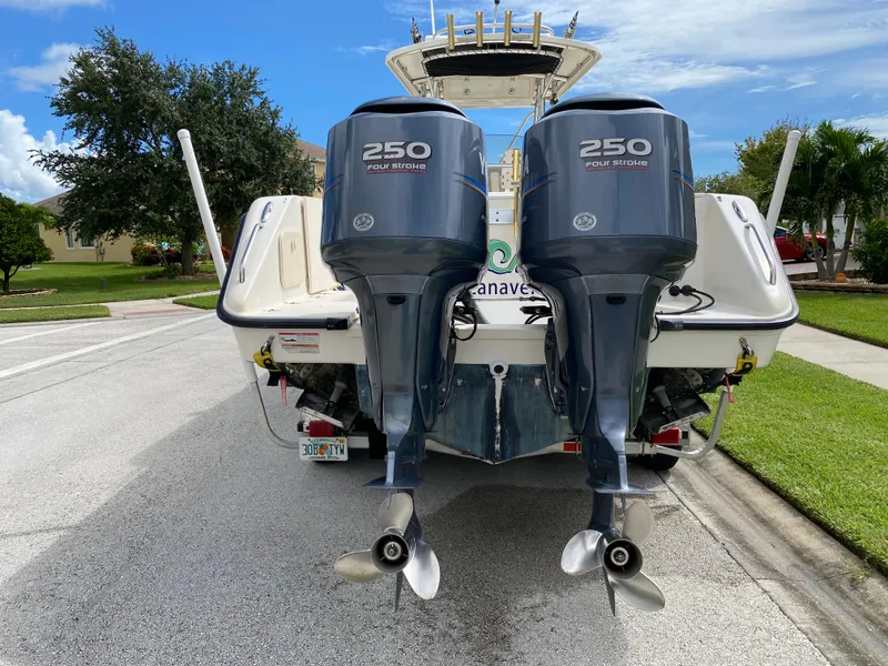 Slide: The Image of 2007 Pursuit 310 Center Console with twin 250 horsepower outboard engines. - 4
