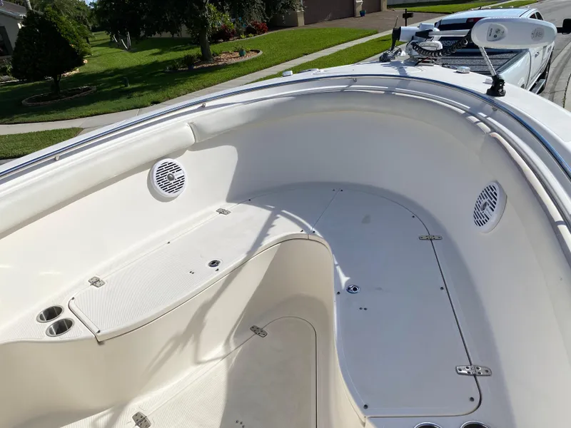 Slide: The Image of 2007 Pursuit 310 Center Console boat interior with seating and speakers. - 7