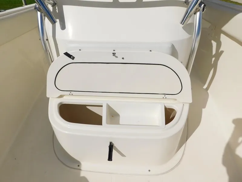 Slide: The Image of 2007 Pursuit 310 Center Console storage compartment with open lid. - 9