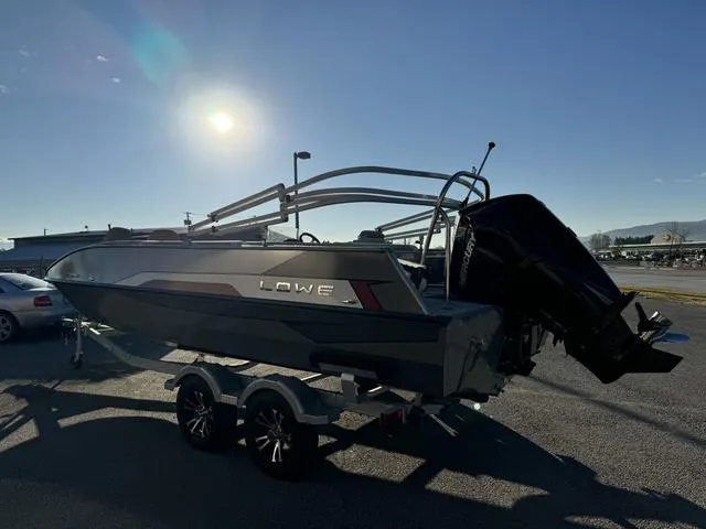 Slide: The Image of 2023 Lowe SD224 boat on trailer under bright sun. - 3