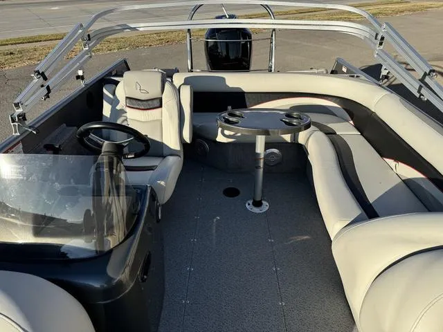 Slide: The Image of 2023 Lowe SD224 boat interior with seating and steering console. - 5