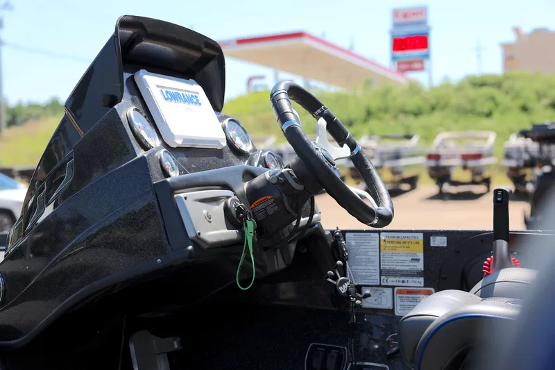 Slide: The Image of 2023 Nitro Z20 Pro boat dashboard with steering wheel and Lowrance display. - 4