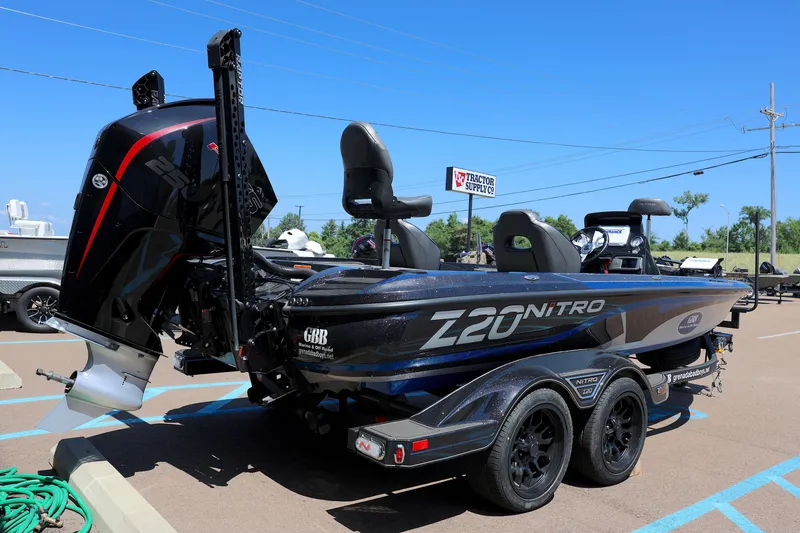 Slide: The Image of 2023 Nitro Z20 Pro boat in parking lot, rear view with motor. - 5