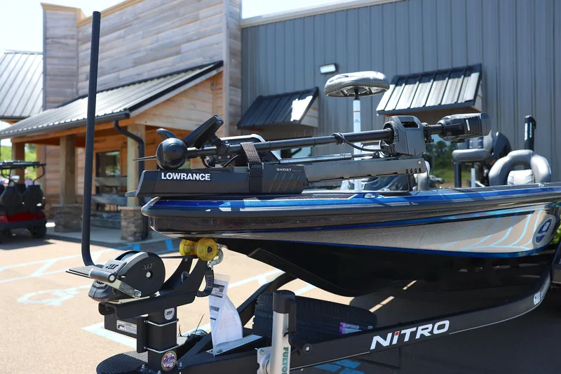 Slide: The Image of 2023 Nitro Z20 Pro boat with Lowrance equipment, parked outside a modern building. - 7