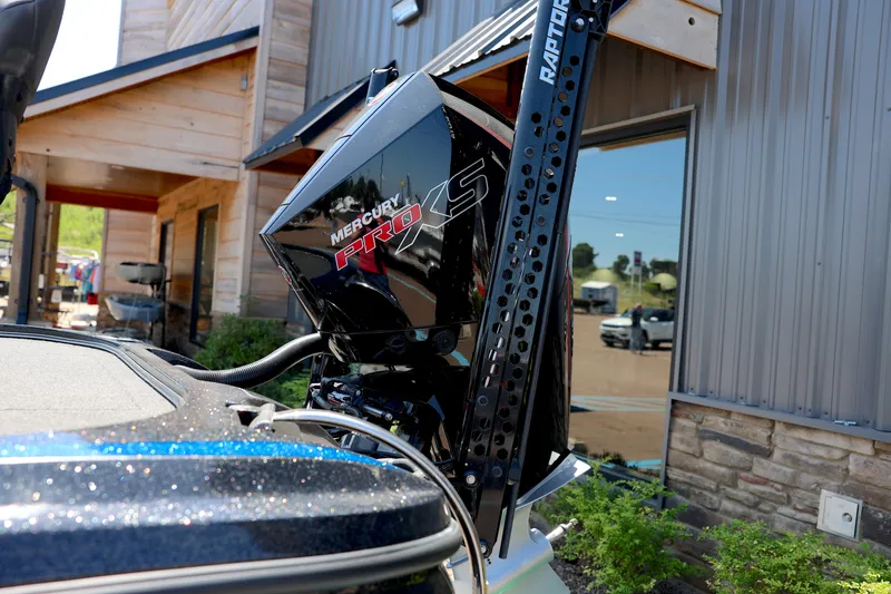 Slide: The Image of 2023 Nitro Z20 Pro boat with Mercury Pro XS engine, parked near a building. - 8