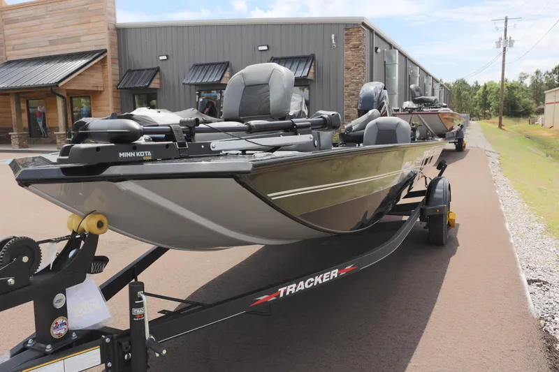 Slide: The Image of 2023 Tracker Pro 170 boat on trailer outside a building. - 4