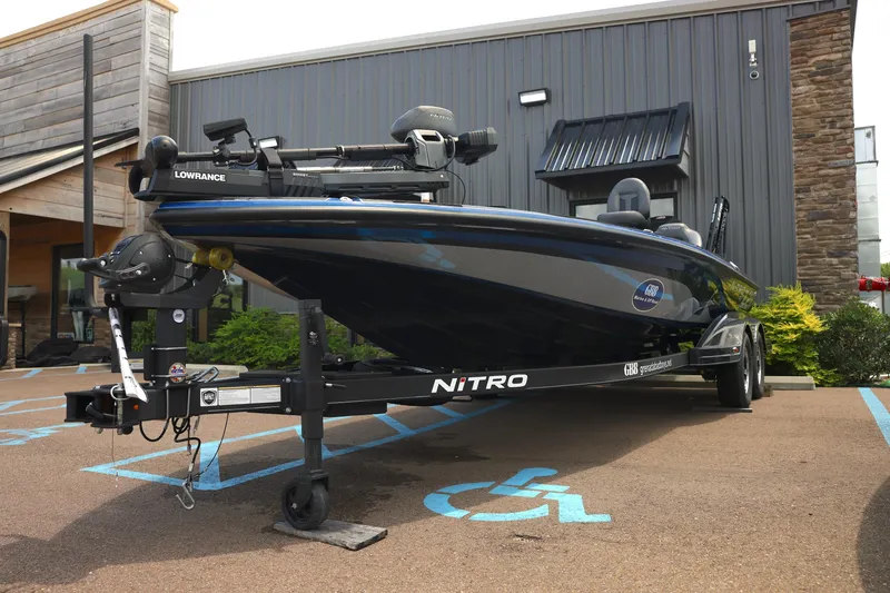 Slide: The Image of 2024 Nitro Z21 XL Pro boat on trailer, parked in front of a building. - 3