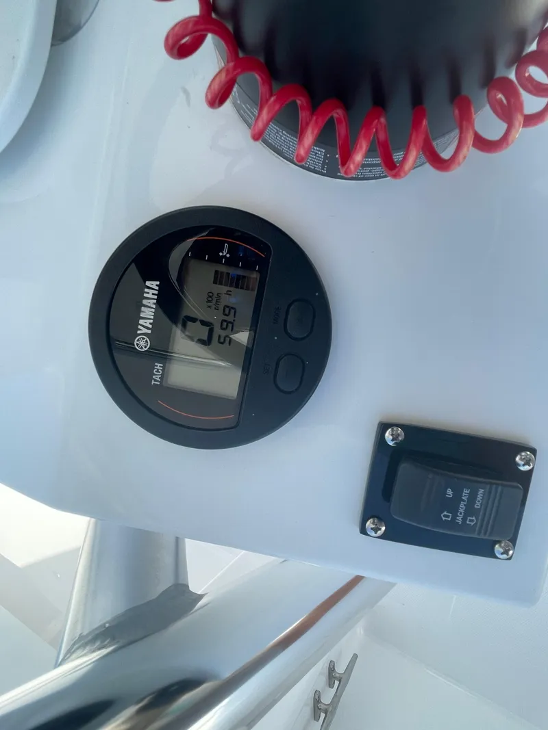 Slide: The Image of Rear view of 2023 Rambo 27 boat with trim tabs and hydraulic system. - 22