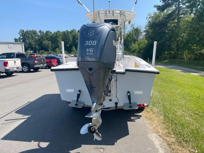 Slide: The Image of 2023 Rambo 27 boat on trailer, featuring Yamaha outboard motor, parked outdoors. - 6