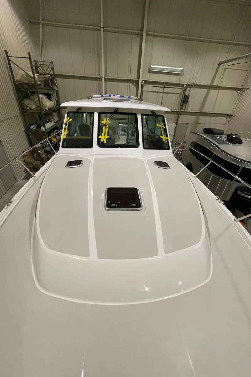 Slide: The Image of 2025 Back Cove 372 boat in storage, showcasing sleek design and modern features. - 12