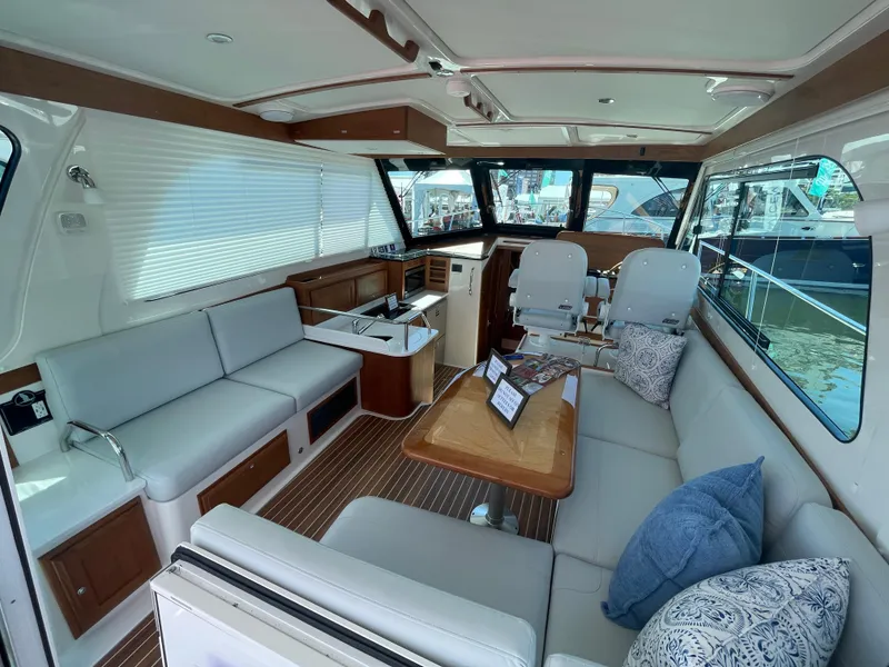 Slide: The Image of Interior of 2025 Back Cove 372 yacht with modern seating and helm station. - 23