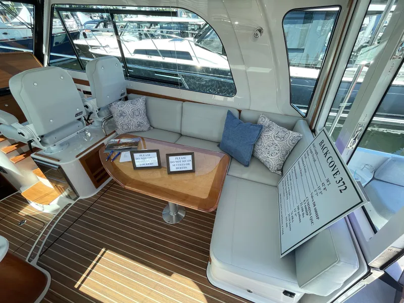Slide: The Image of Interior of 2025 Back Cove 372 yacht with seating and table, showcasing luxury design. - 26