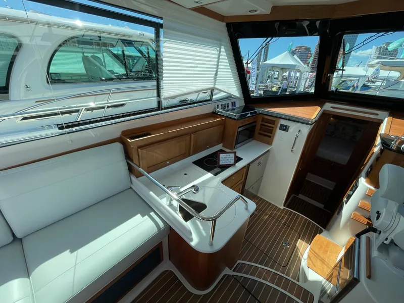 Slide: The Image of Interior of 2025 Back Cove 372 yacht with modern seating and wooden accents. - 27