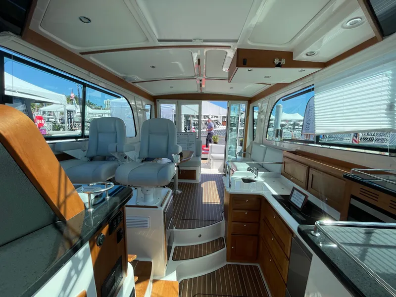 Slide: The Image of Interior of 2025 Back Cove 372 yacht with modern seating and kitchen area. - 38