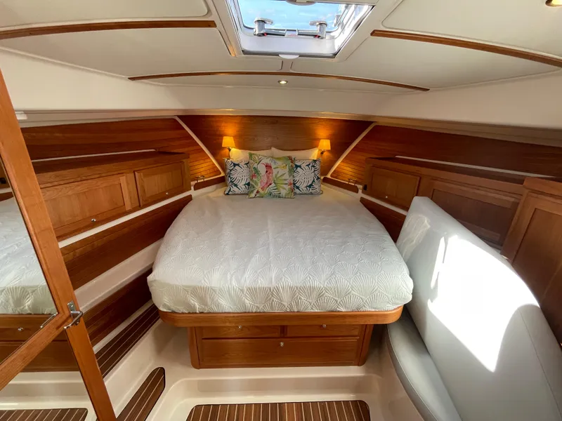 Slide: The Image of Luxurious cabin interior of 2025 Back Cove 372 yacht with cozy bed and elegant wood finish. - 40