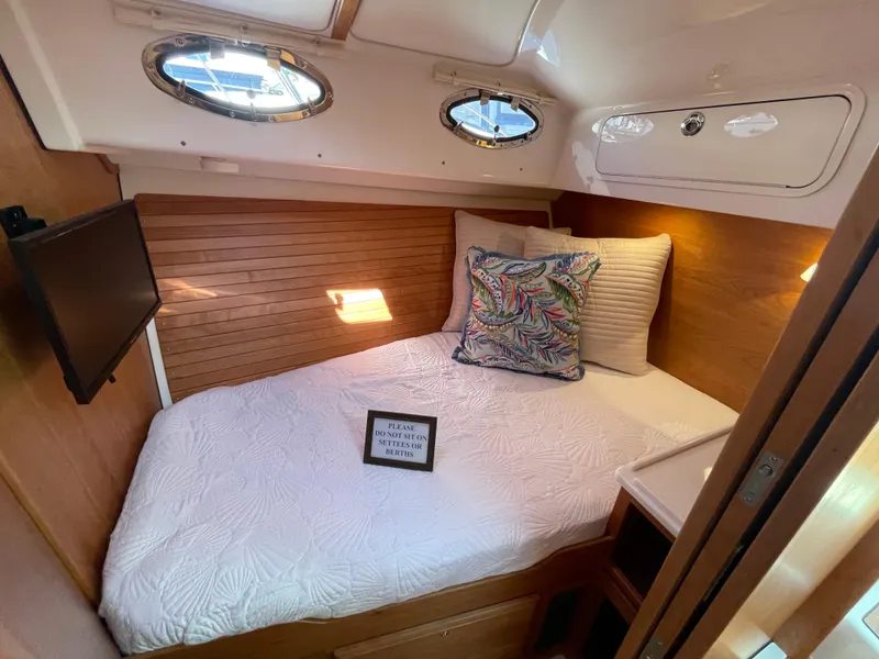 Slide: The Image of Cozy cabin interior of 2025 Back Cove 372 yacht with bed and portholes. - 48