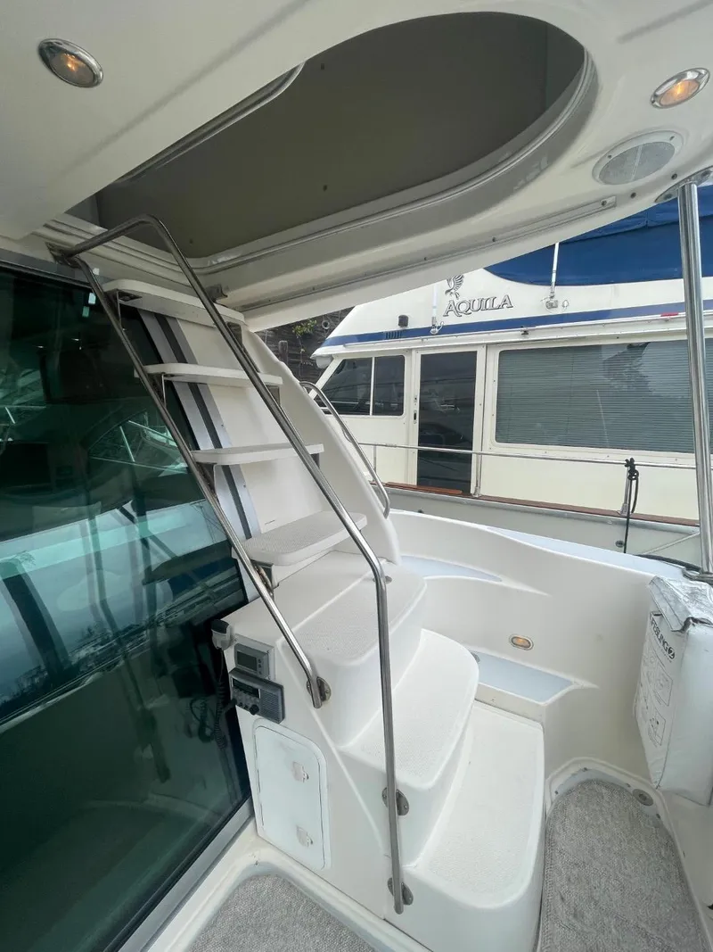 Slide: The Image of Staircase on 1997 Maxum 4600 Custom SCB yacht, leading to upper deck. - 10