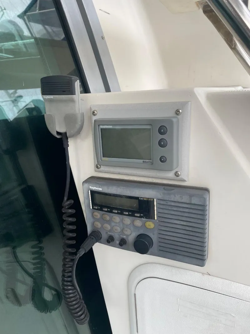 Slide: The Image of Control panel with radio and display on 1997 Maxum 4600 Custom SCB yacht. - 11