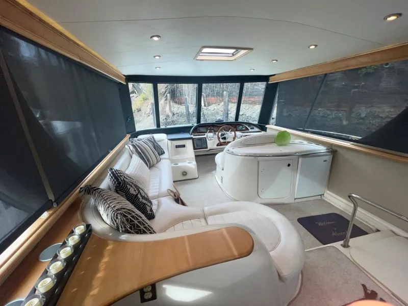 Slide: The Image of Luxurious interior of 1997 Maxum 4600 Custom SCB yacht with plush seating and modern helm. - 17