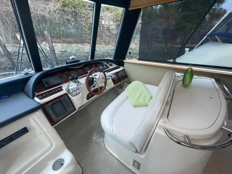 Slide: The Image of 1997 Maxum 4600 Custom SCB yacht interior with steering wheel and navigation equipment. - 20