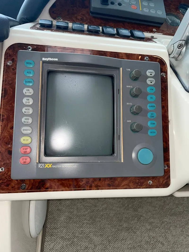 Slide: The Image of Raytheon marine navigation system on 1997 Maxum 4600 Custom SCB yacht dashboard. - 23