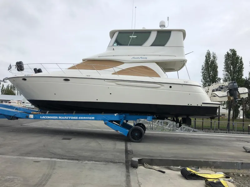 Slide: The Image of 1997 Maxum 4600 Custom SCB yacht on trailer at marina. - 3