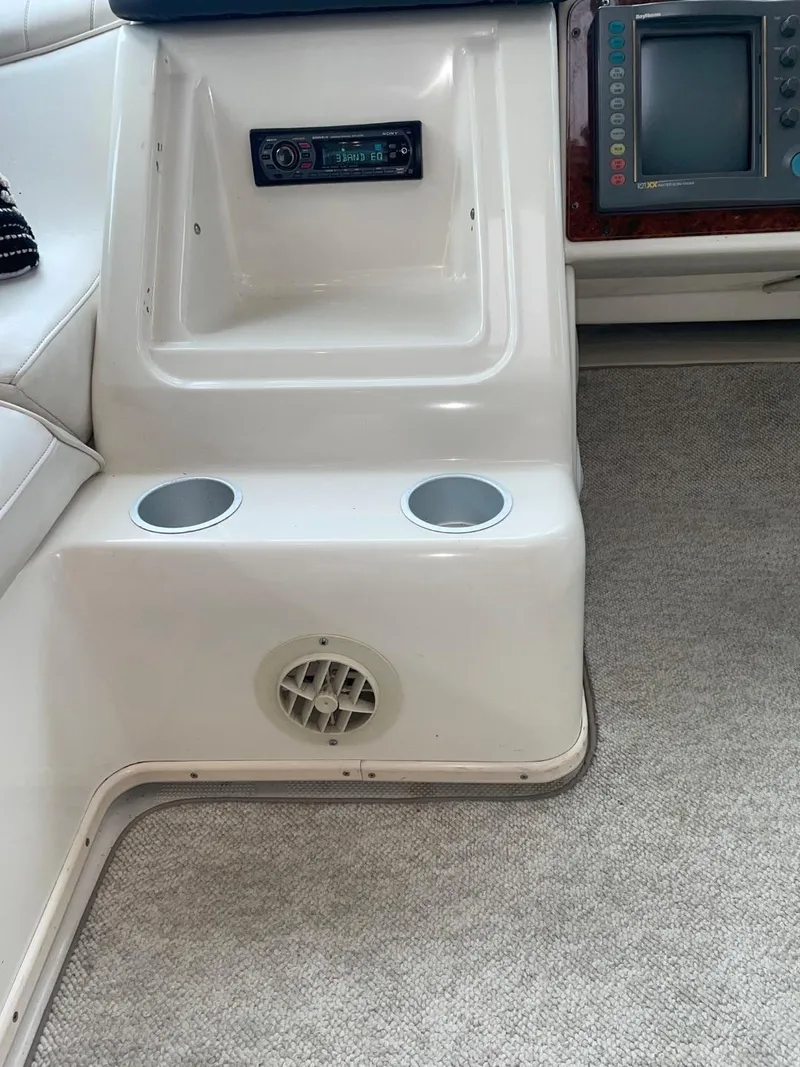 Slide: The Image of 1997 Maxum 4600 Custom SCB interior with control panel and cup holders. - 33