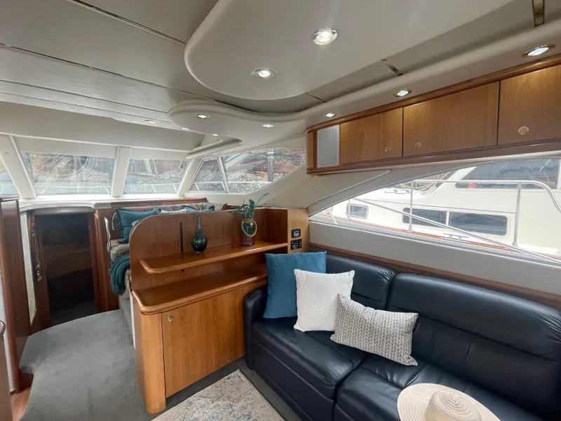 Slide: The Image of Interior of 1997 Maxum 4600 Custom SCB yacht with leather seating and wooden cabinetry. - 36
