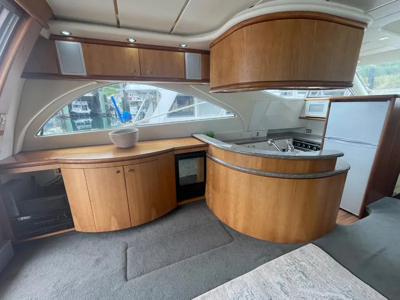 Slide: The Image of Interior of a 1997 Maxum 4600 Custom SCB yacht with modern kitchen amenities. - 37