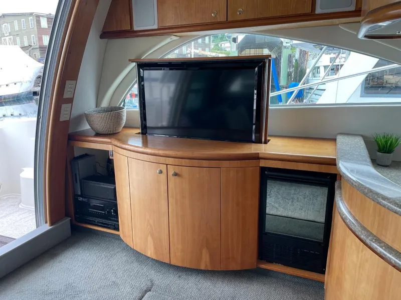 Slide: The Image of Interior of 1997 Maxum 4600 Custom SCB yacht with TV and wooden cabinetry. - 38