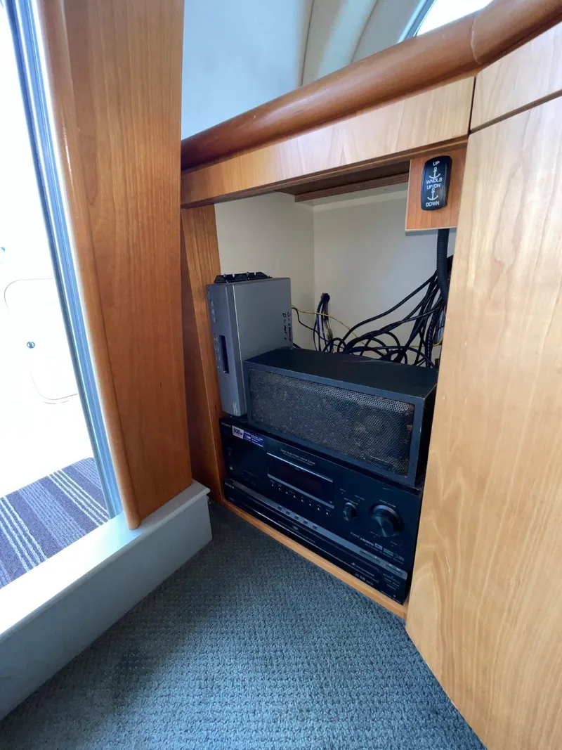 Slide: The Image of 1997 Maxum 4600 Custom SCB interior electronics cabinet with audio equipment. - 40