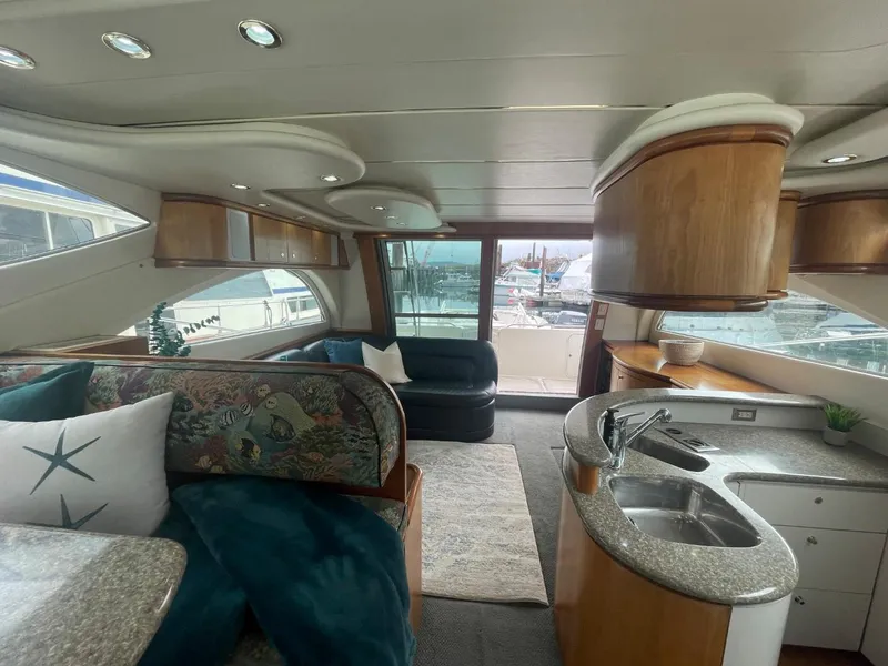Slide: The Image of Interior of 1997 Maxum 4600 Custom SCB yacht with modern furnishings and kitchen area. - 45