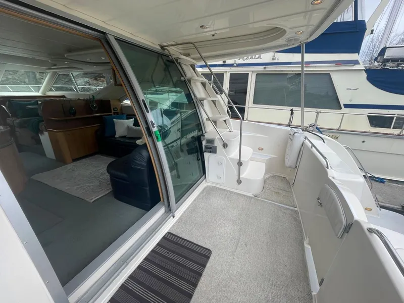 Slide: The Image of 1997 Maxum 4600 Custom SCB yacht with spacious deck and modern interior. - 6