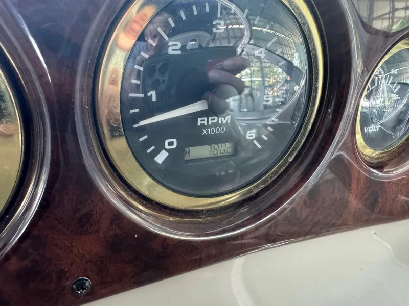 Slide: The Image of Close-up of 2000 Rinker 330 Fiesta Vee RPM gauge on dashboard. - 12