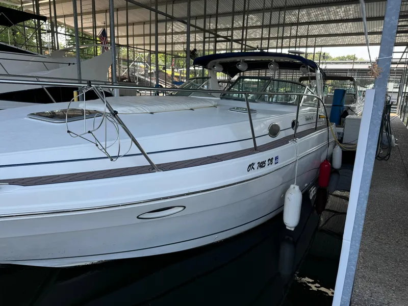 Slide: The Image of 2000 Rinker 330 Fiesta Vee boat docked in covered marina. - 5