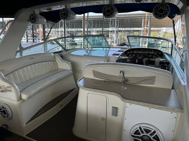 Slide: The Image of Interior of 2000 Rinker 330 Fiesta Vee boat with seating and helm. - 8