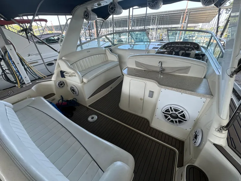 Slide: The Image of 2000 Rinker 330 Fiesta Vee boat interior with seating and helm. - 9