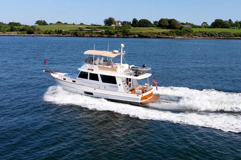 Slide: The Image of 2014 Grand Banks 43 Europa yacht cruising on open water. - 12