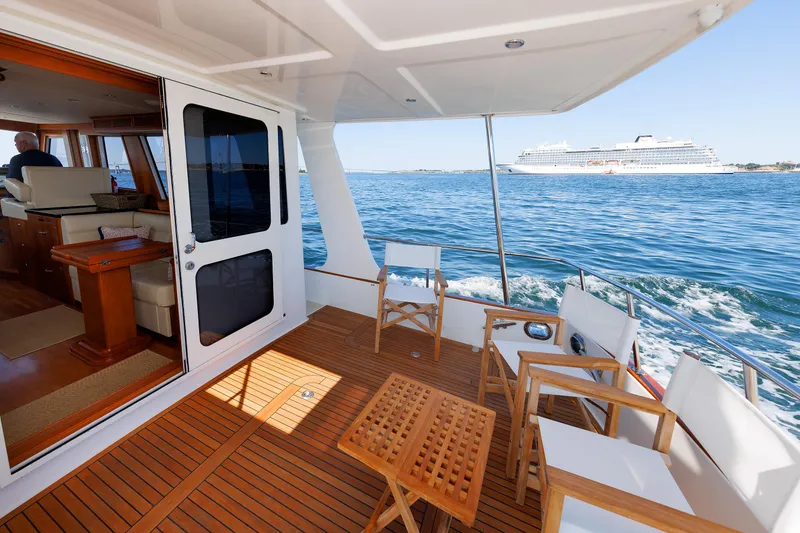 Slide: The Image of Grand Banks 43 Europa 2014 yacht deck with ocean view and cruise ship in background. - 21