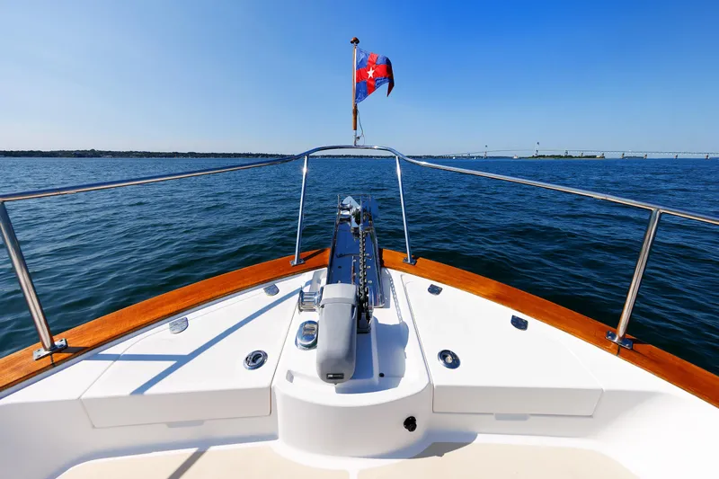 Slide: The Image of Grand Banks 43 Europa 2014 yacht bow on open water, clear blue sky. - 24