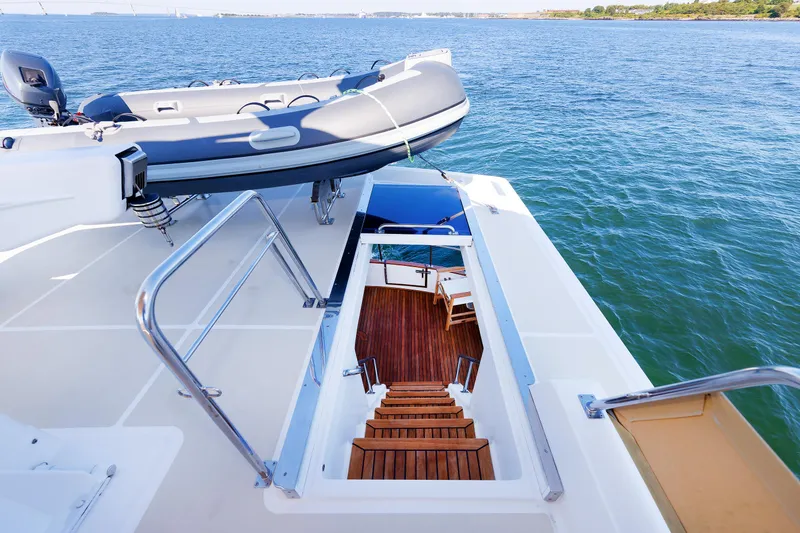Slide: The Image of Grand Banks 43 Europa 2014 yacht with wooden stairs and inflatable boat on deck. - 28