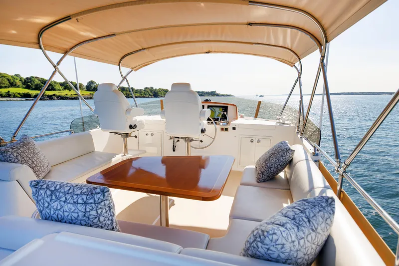 Slide: The Image of Luxurious 2014 Grand Banks 43 Europa yacht interior with seating and scenic ocean view. - 30